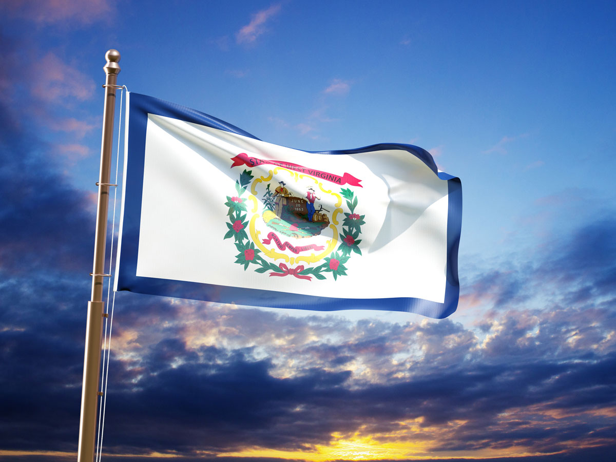 West Virginia flag against sunset