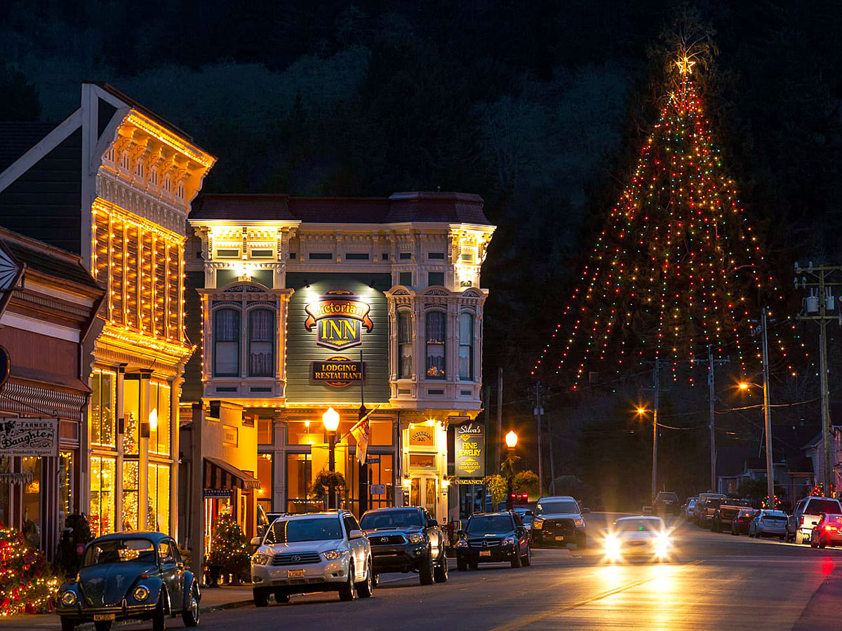 View of downtown Ferndale, California, with Main Street Christmas Tree lit at night
