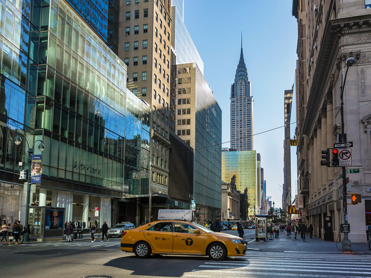 Taxi on midtown Manhattan street with view of Chrysler Building
