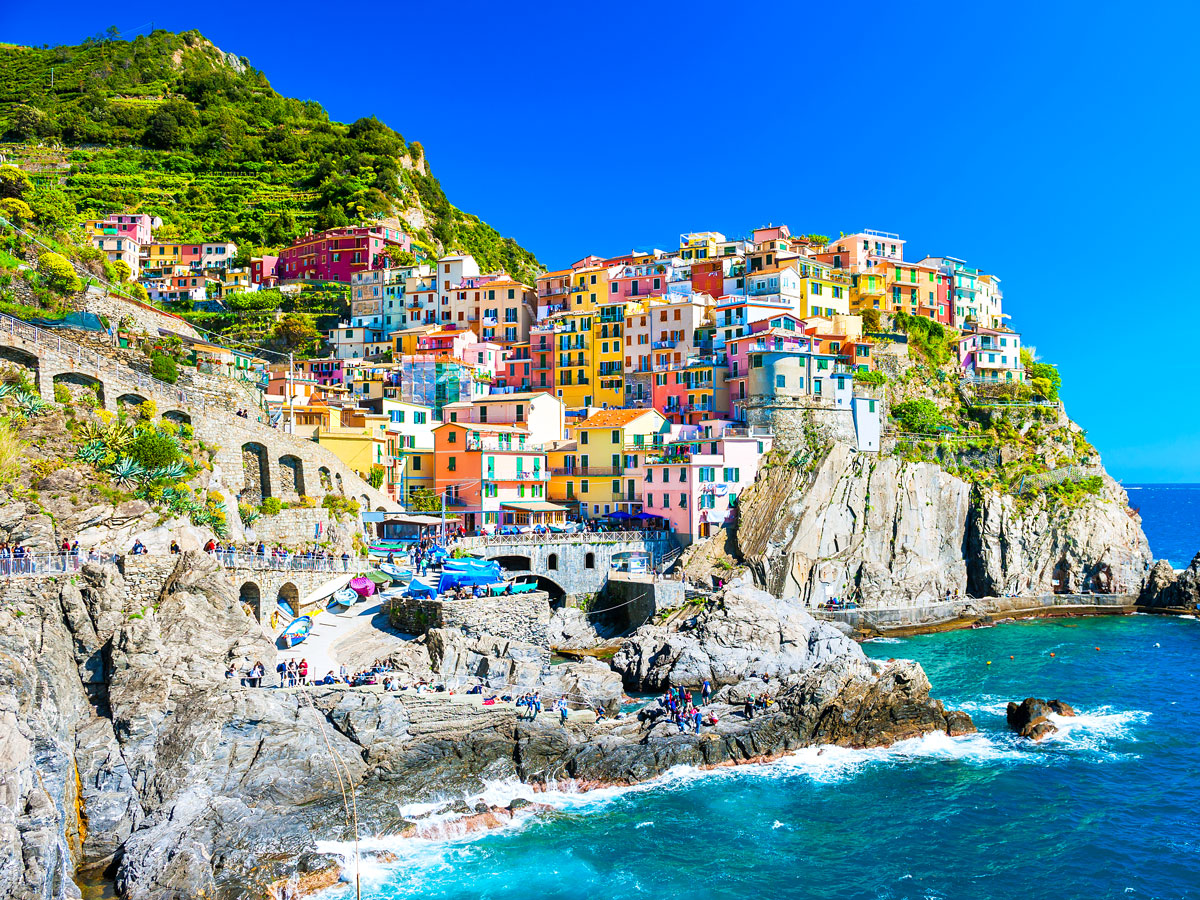 Colorful buildings on cliff overlooking the Mediterranean Sea in Cinque Terre, Italy