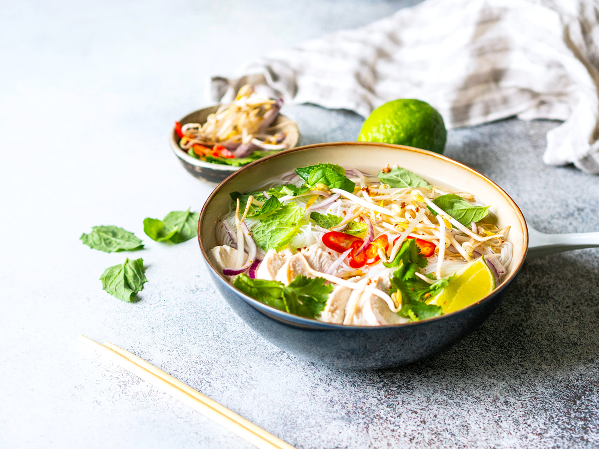 Bowl of pho with accoutrements 