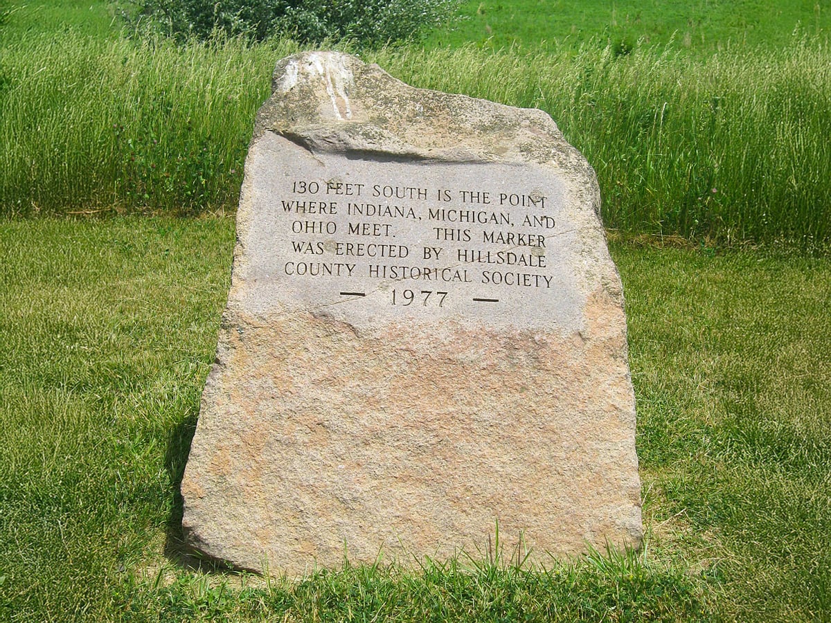 Sign denoting point where Indiana, Michigan, and Ohio meet