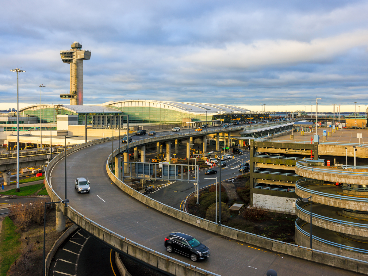 Aerial view of roadway, terminals, and control tower at JFK Airport in New York City