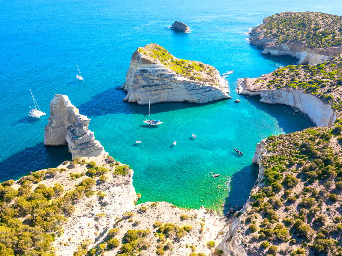 Aerial view of cove with turquoise water on the island of Milos