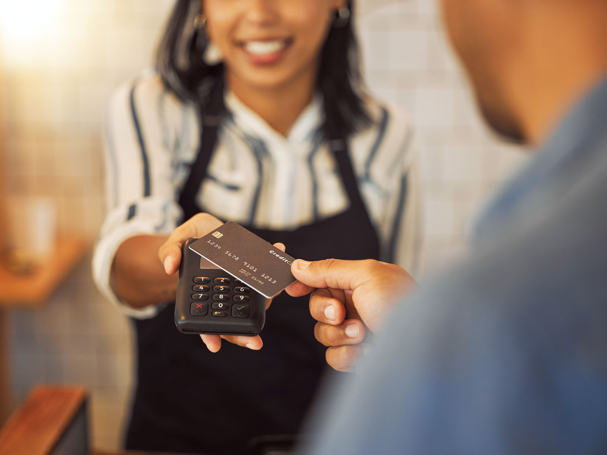 Customer tapping card on credit card payment machine