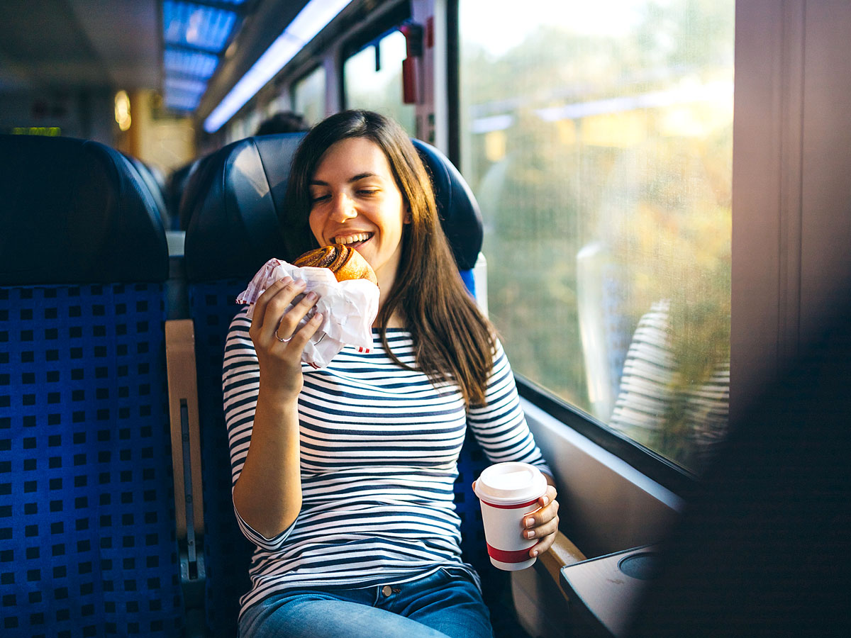 Woman eating on train
