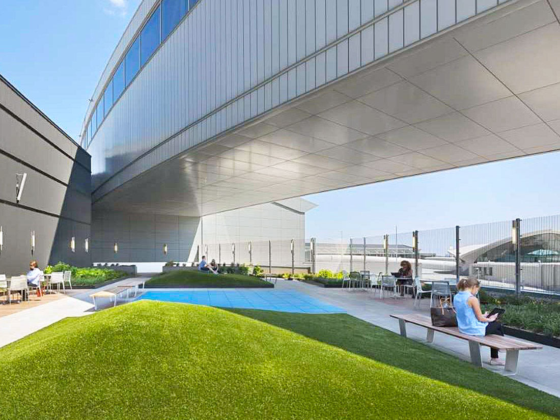 Passengers enjoying outdoor terrace at New York's JFK Airport