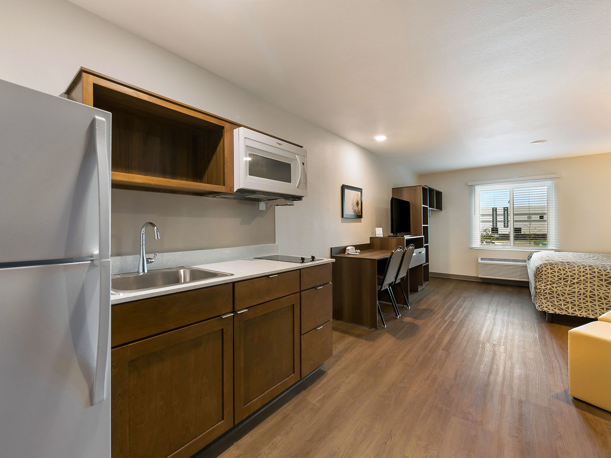 Extended-stay hotel suite with kitchenette