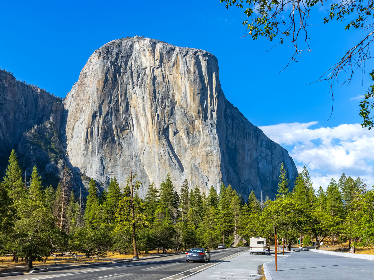 Road through Yosemite next to El Capitan rock formation