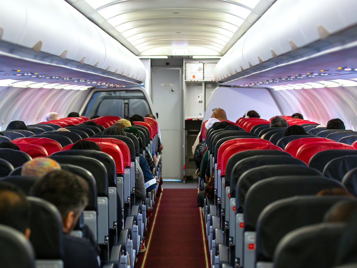 Airplane cabin with three-by-three seating