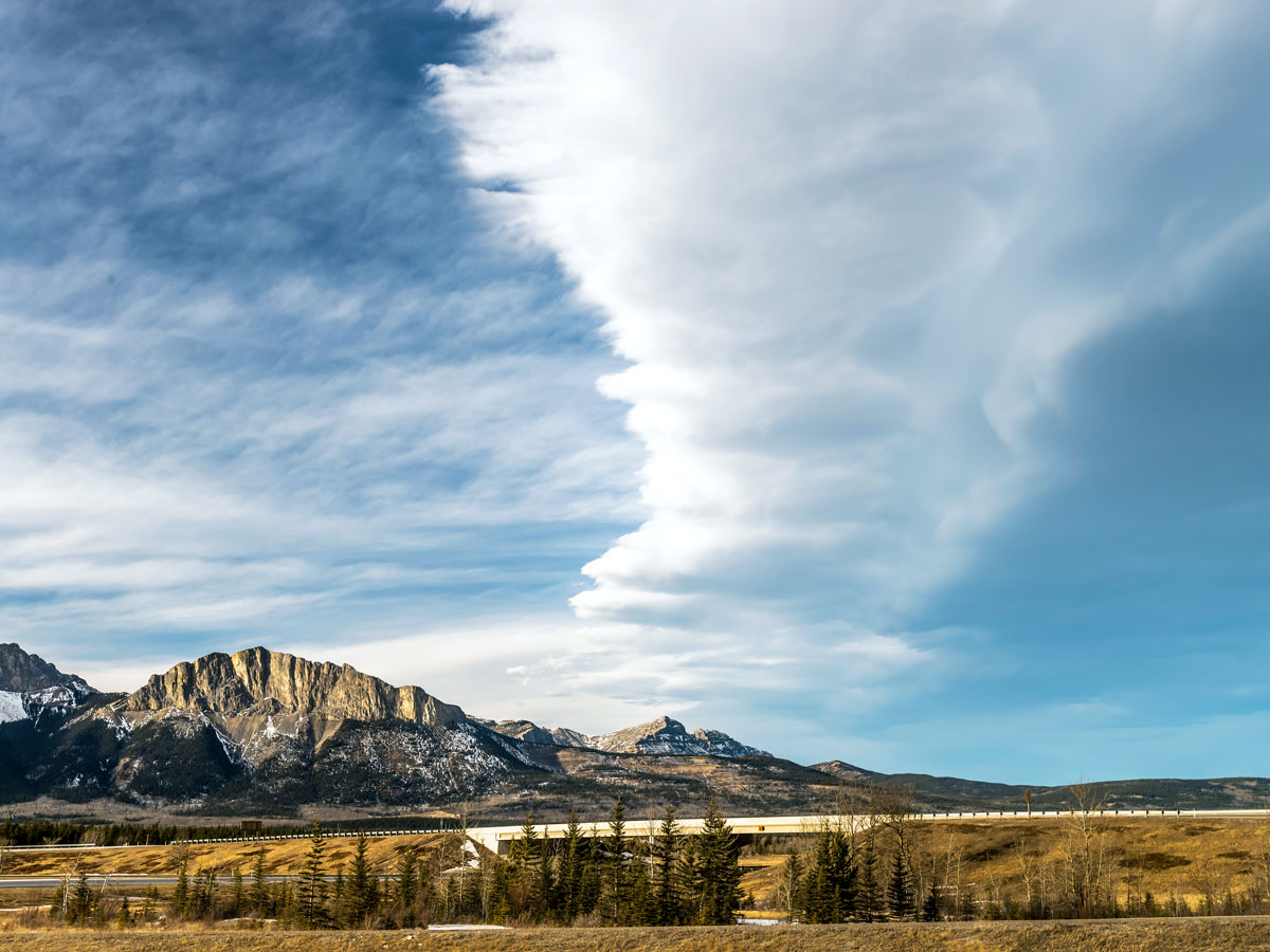 Weather system over mountainous landscape