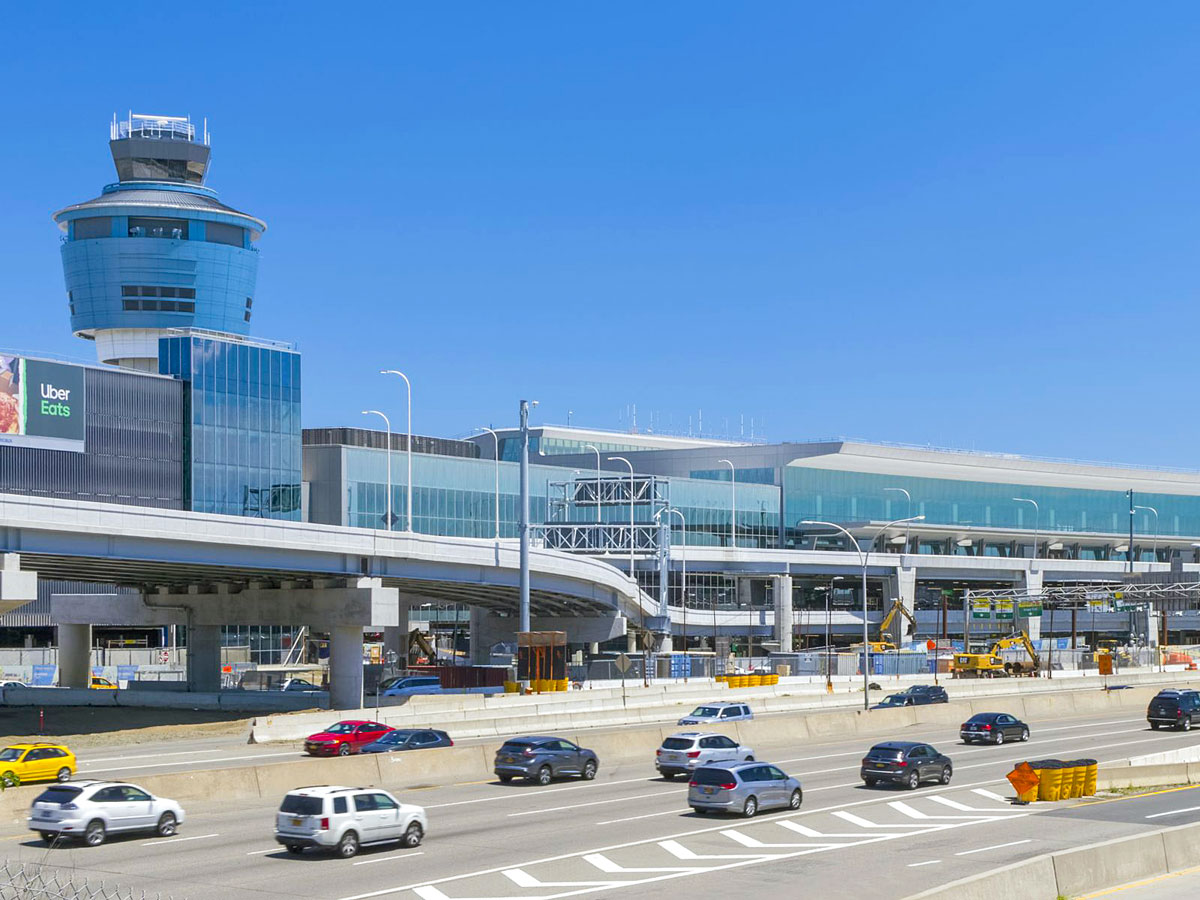 Roadway in front of parking garage and air traffic control tower at LaGuardia Airport