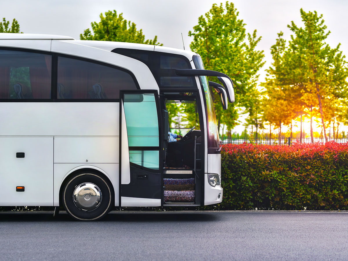 Shuttle bus parked with passenger door open