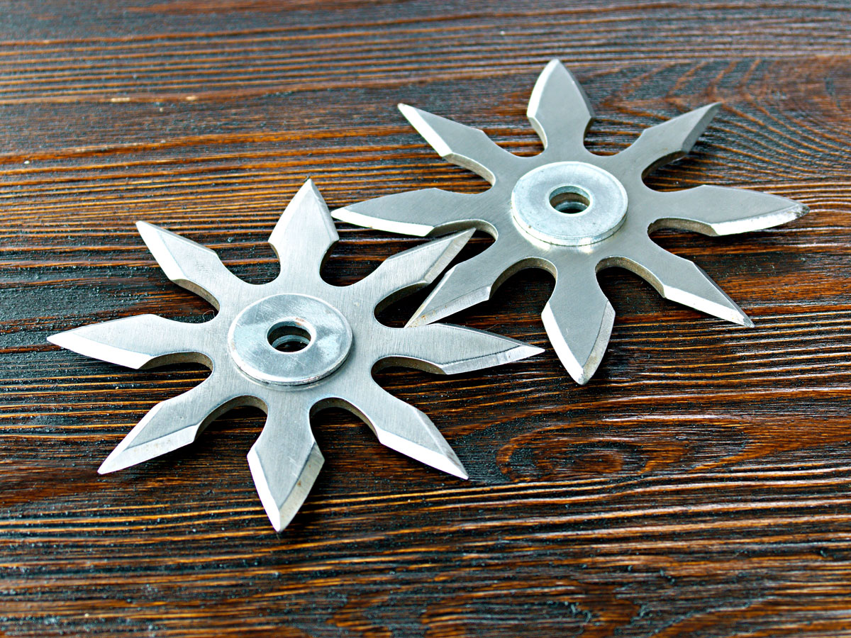 Pair of ninja blades on wood table