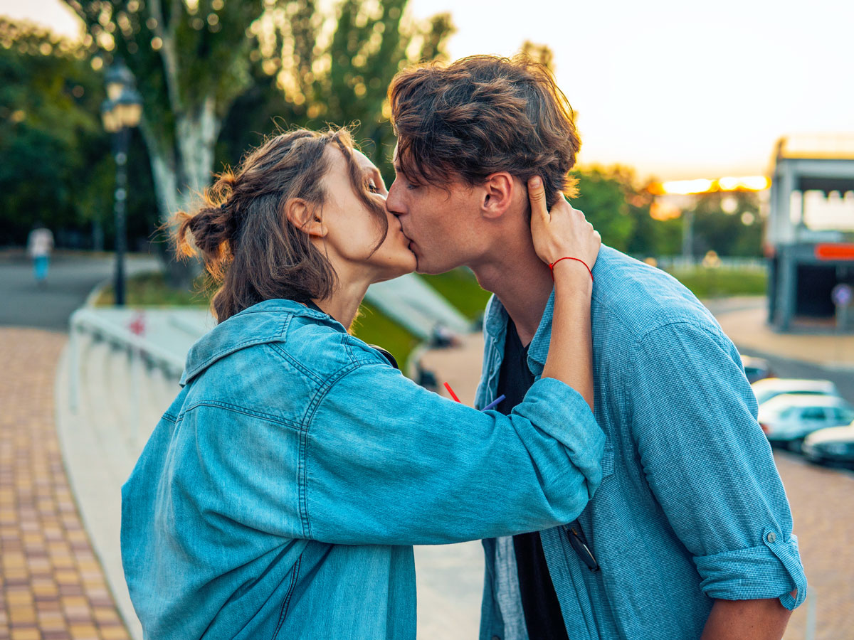 Two people kissing in public