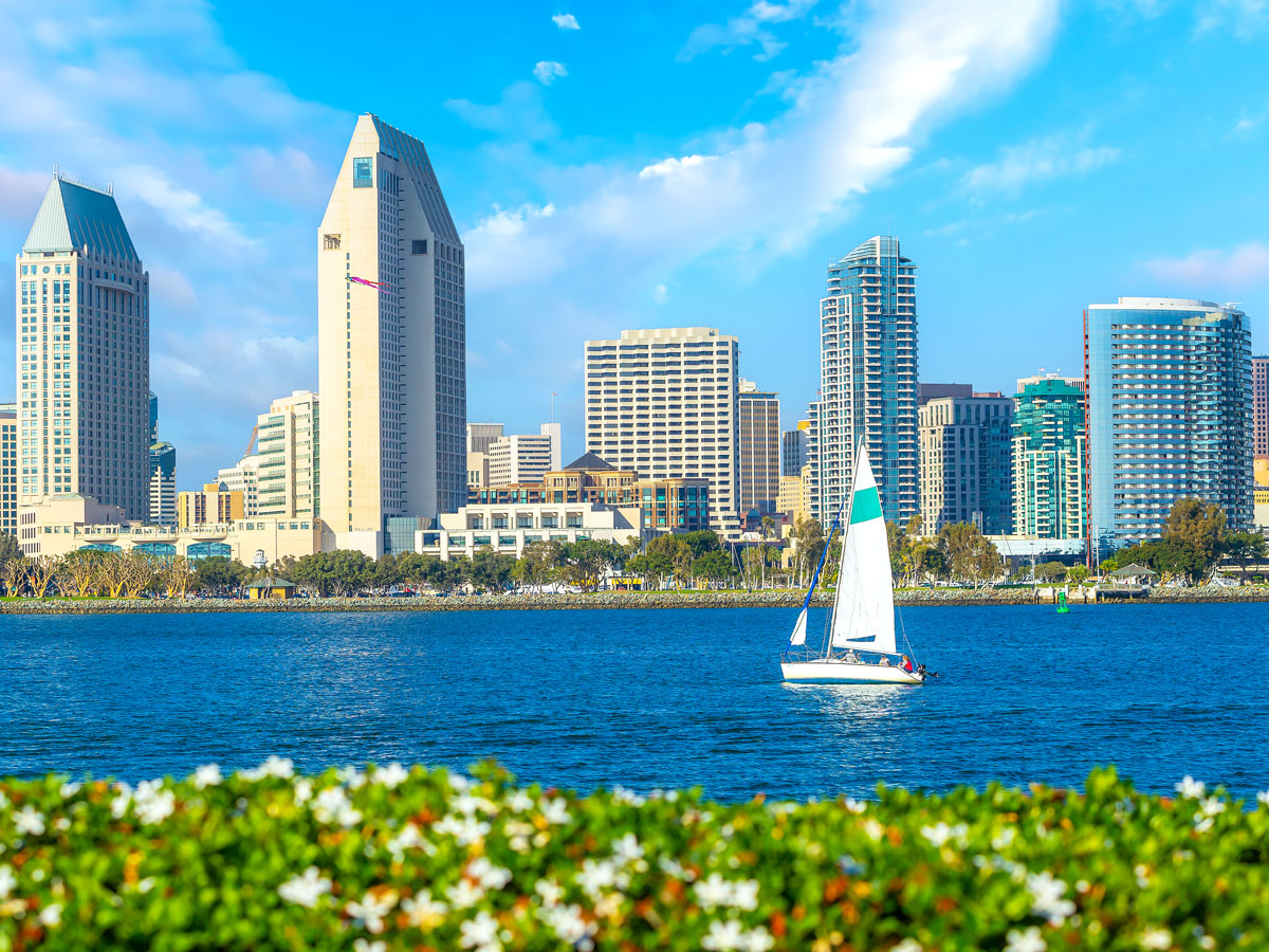 Sailboat with in front of San Diego skyline