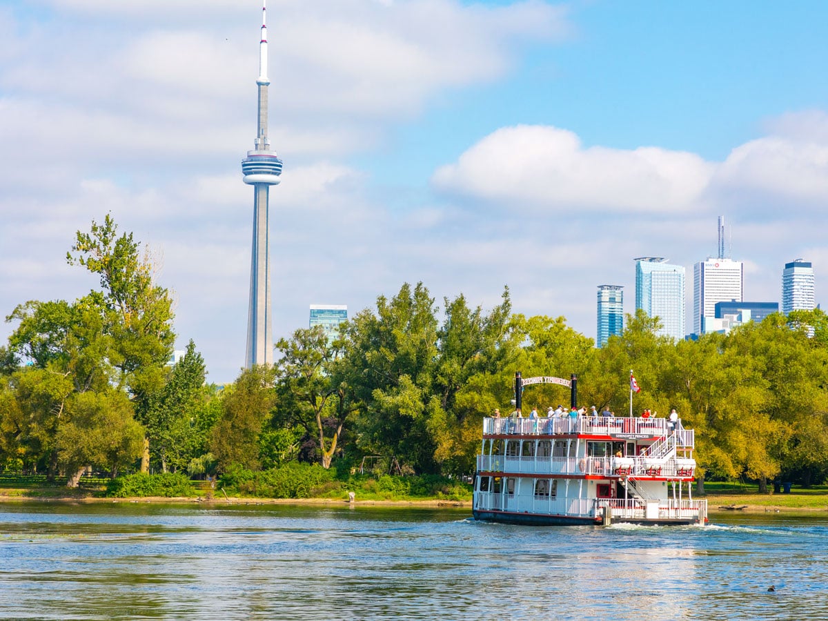 Ferry arriving at Toronto Islands with skyline view in background