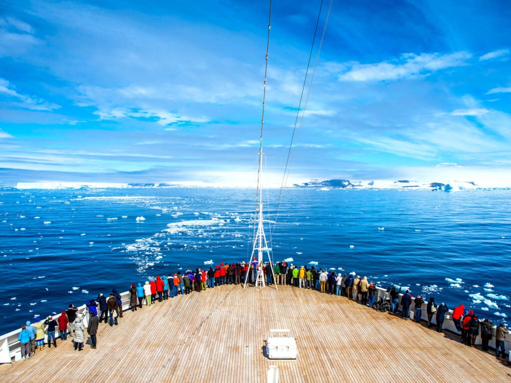 Passengers on bow of cruise ship in Antarctica 
