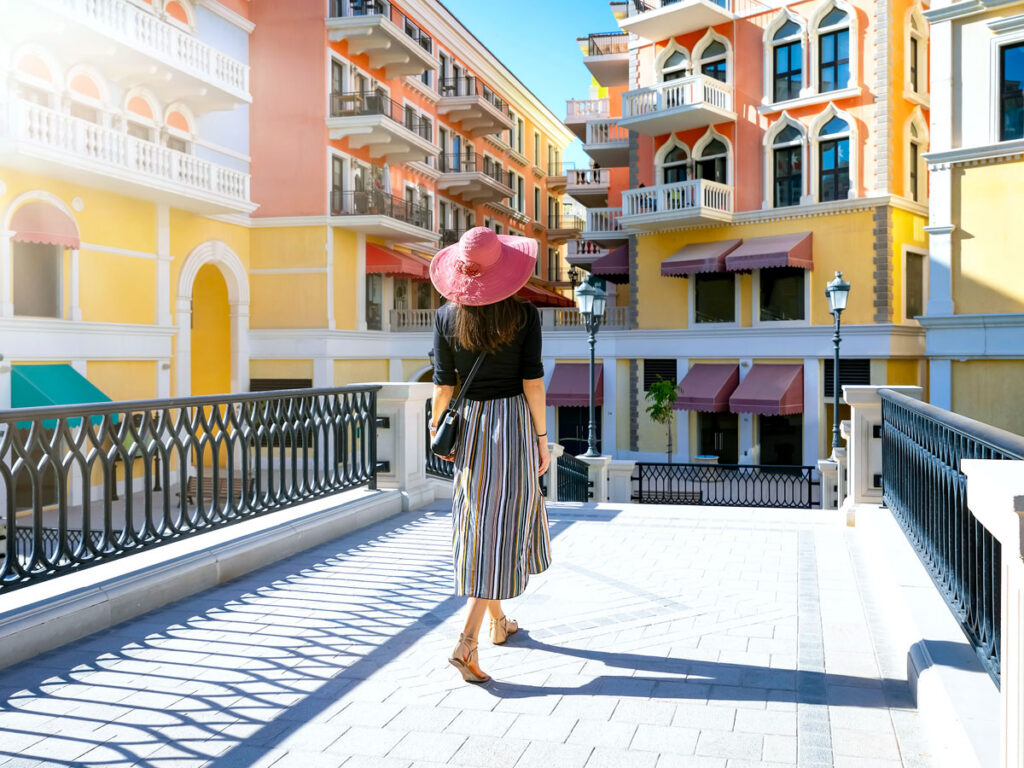 Tourist looking at brightly painted buildings